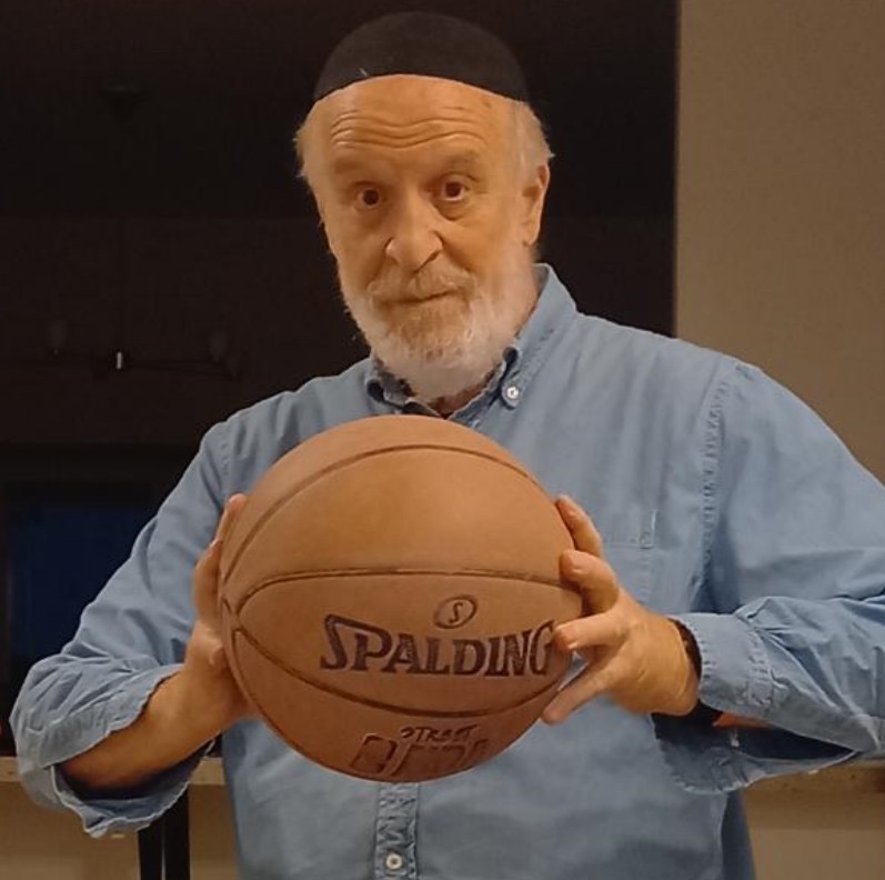 Rabbi Gedaliah Gurfein holding a basketball
